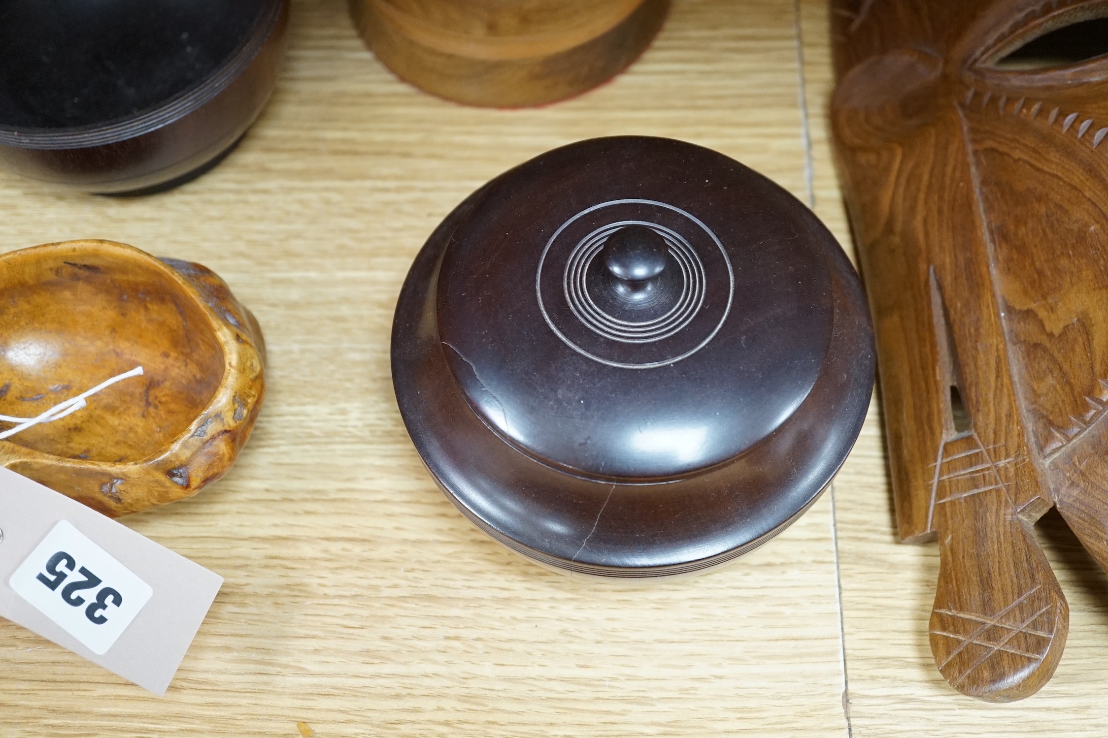 A quantity of African and other carvings including an ostrich egg